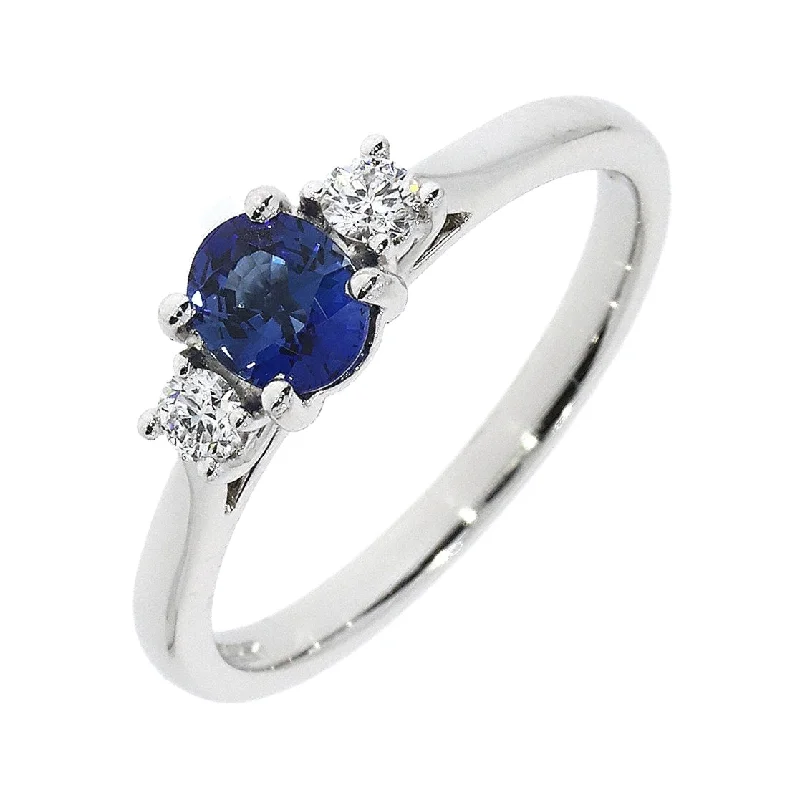 18ct white gold claw set oval cut Sapphire and 2 brilliant cut Diamond ring