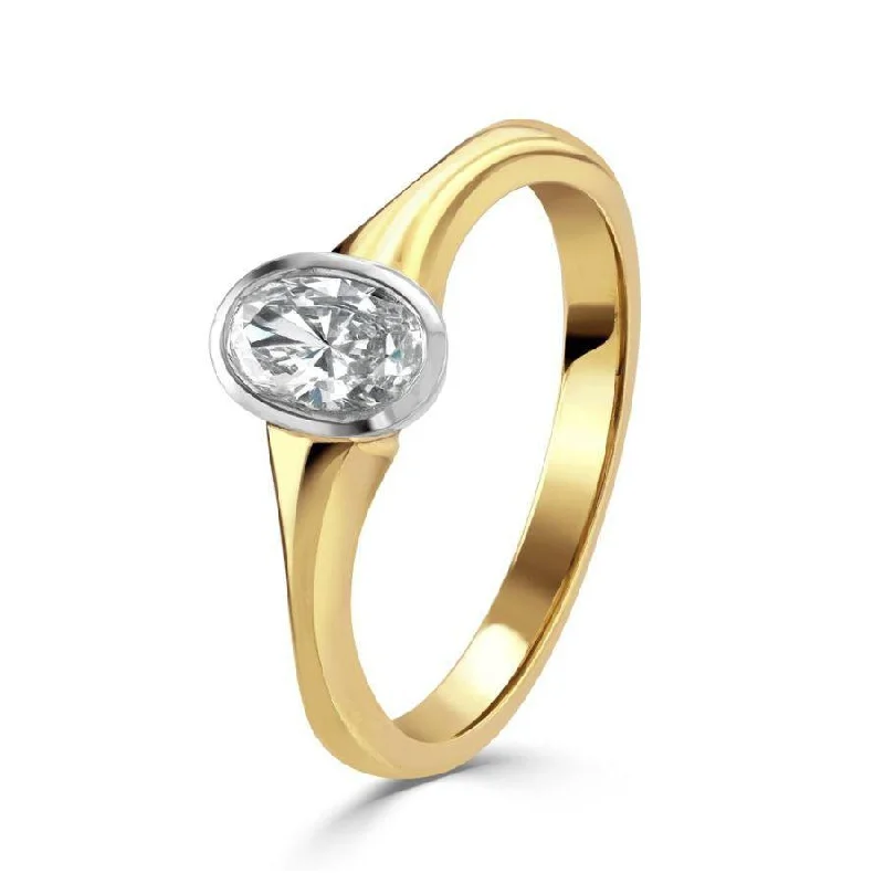 18ct yellow & white gold oval cut diamond ring